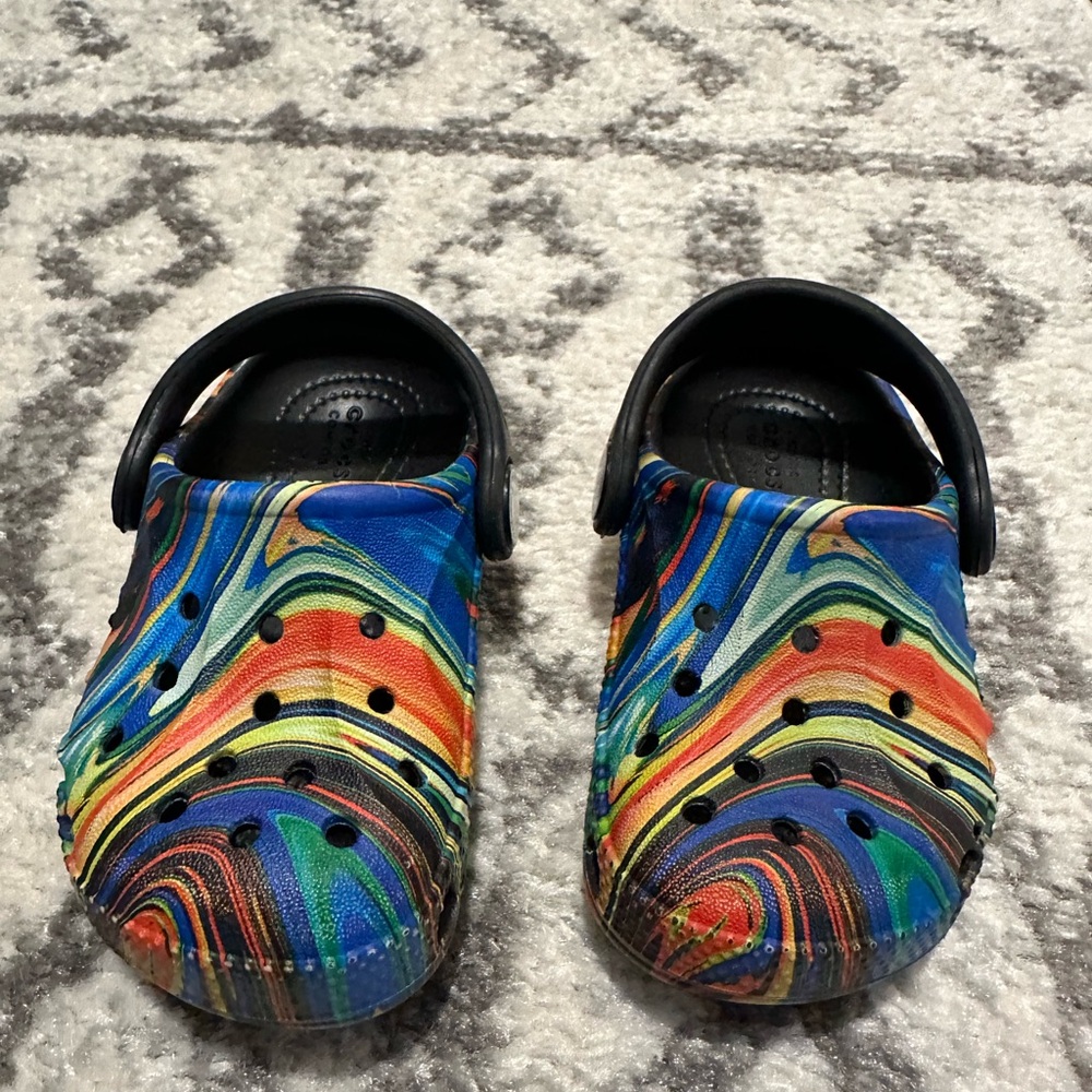 CROCS Kids Rainbow Swirl Clogs with Black Strap